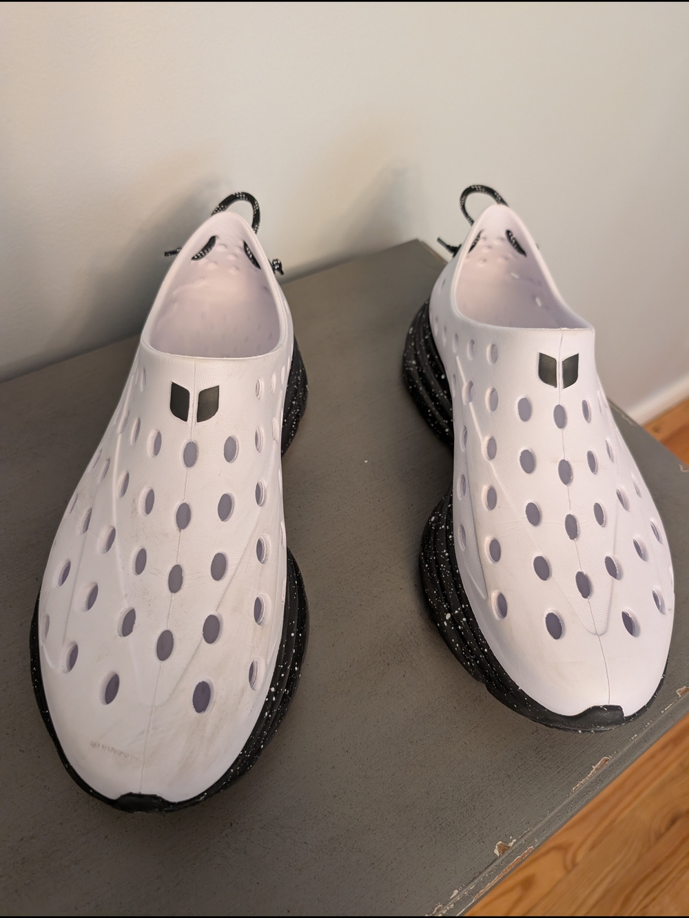 Women’s White Slip-On Athletic Shoe with Black Speckled Sole
